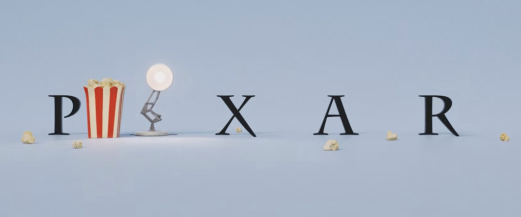 Pixar logo variation with Luxo Jr. bouncing on the letter 'I' alongside scattered popcorn and a red-and-white popcorn bucket, symbolizing Pixar Popcorn series.